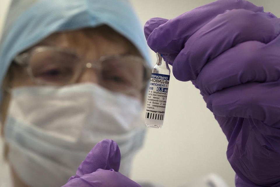 A medical worker prepares a shot of Russia's Sputnik V coronavirus vaccine in a local rural medical post in the village of Ikhala in Russia’s Karelia region, Tuesday, Feb. 16, 2021. Russia took pride in being the first country to approve a coronavirus vaccine, although it faced criticism from aboard for doing it before completing the advanced testing necessary to ensure Sputnik V’s safety and effectiveness. (AP Photo/Dmitri Lovetsky)