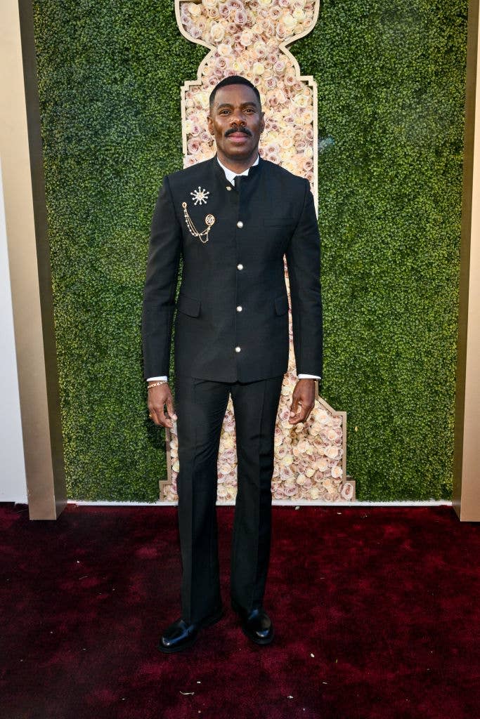 He's wearing a suit with a few medallions