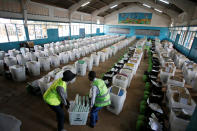 <p>Election officials from the Independent Electoral and Boundaries Commission (IEBC) arrange ballot boxes and election material at a holding center before distribution to polling centers, in Nairobi, Kenya, Aug. 7, 2017. (Photo: Baz Ratner/Reuters) </p>