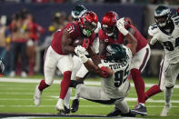 Houston Texans running back Dameon Pierce (31) carries against Philadelphia Eagles defensive tackle Marlon Tuipulotu (95) in the second half of an NFL football game in Houston, Thursday, Nov. 3, 2022. (AP Photo/Eric Christian Smith)