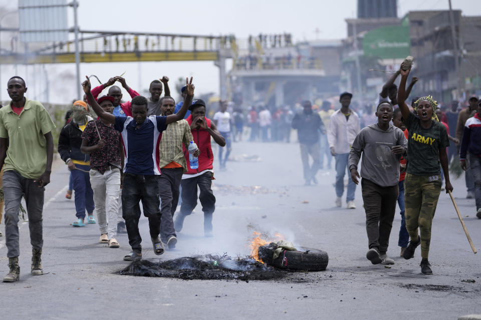 Protesters block the busy Nairobi - Mombasa highway in the Mlolongo area, Nairobi, Kenya Tuesday, July 2, 2024. Protests have continued to rock several towns in Kenya including the capital Nairobi, despite the president saying he will not sign a controversial finance bill that sparked deadly protests last week. (AP Photo/Brian Inganga)