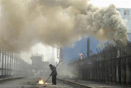 A labourer works at a coking plant in Changzhi, north China's Shanxi province, July 7, 2007. REUTERS/Stringer
