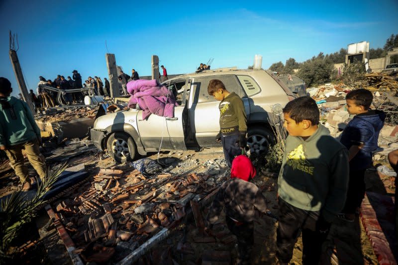 Palestinians search for victims under the rubble after an Israeli strike on residential house in Morag village, south of Khan Yunis, Gaza Strip, on Sunday. Secretary Antony Blinken kicked off a Middle Eastern diplomatic push as the Israeli-Gaza conflict threatens to expand into a regional one. Photo by Ismael Mohamad/UPI