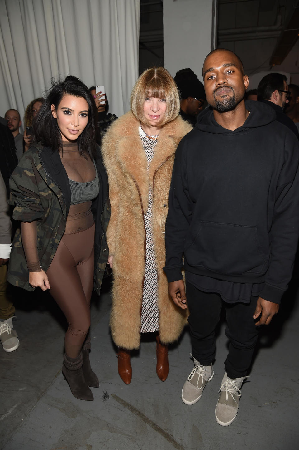 Kim Kardashian, Anna Wintour, and Kanye West pose for picture backstage