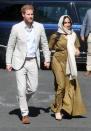 The Duchess of Sussex dressed respectfully in a cream head scarf and khaki maxi dress for a visit to South Africa's oldest mosque on day two of the tour. <em>[Photo: Getty]</em>