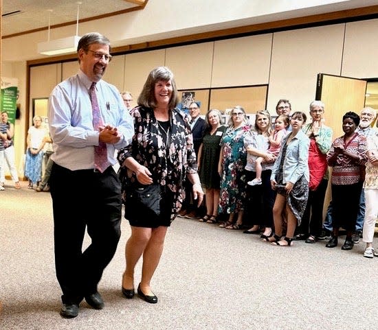 Pastors Dave Sutter and Janice Yordy Sutter are welcomed at a reception following their final service at Kern Road Mennonite Church in South Bend.