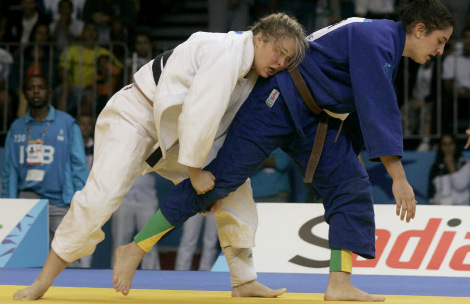 Ronda Rousey of U.S. (white) battles with Brazil's Mayra Silva to win the gold medal of the Women's 70kg judo competition of the Pan American games of Rio de Janeiro, July 20, 2007. REUTERS/Bruno Domingos (BRAZIL)