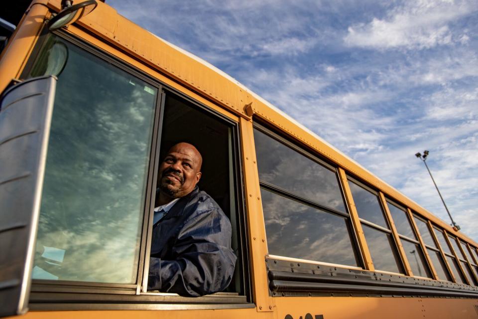 John Lewis chats with colleagues as he arrives at Gardena bus yard