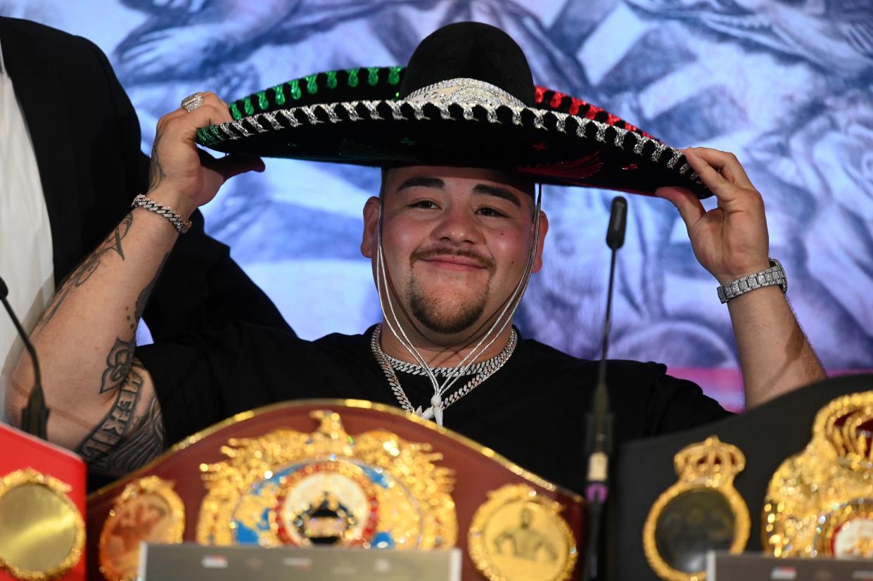 Mexican-US WBA, IBF, WBO and IBO heavyweight boxing champion Andy Ruiz Jr smiles as he puts on a Mexican hat at promotional press conference for the "Clash on the Dunes" fight against Britain's Anthony Joshua due to take place in December, in London on September 6, 2019. - The "Clash on the Dunes" is scheduled to take place in Diriya, Saudi Arabia on December 7. (Photo by DANIEL LEAL-OLIVAS / AFP)        (Photo credit should read DANIEL LEAL-OLIVAS/AFP via Getty Images)