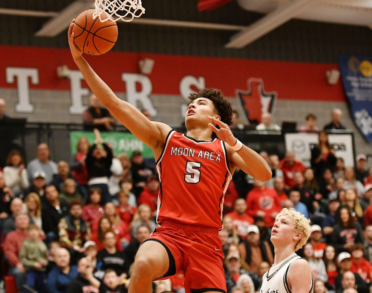 Moon’s Elijah Guillory shoots over Franklin Regional’s Colin Masten during Monday’s PIAA class 5A semifinal game at Peters Township High School.