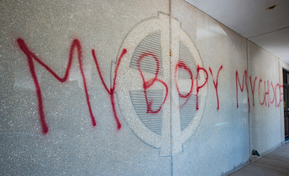 The phrase "My body, my choice" is seen on the wall of the Ascension Catholic School in Overland Park. Other church buildings and property were also spray-painted.