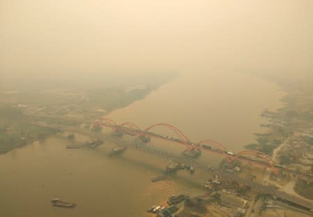 An aerial view of Palembang city covered by smoke from the forest fire in South Sumatra province