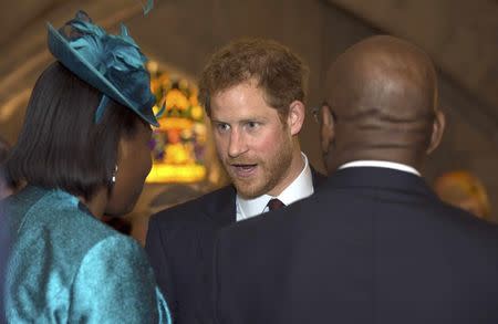 Prince Harry speaks to guests during a reception at the Guildhall following a service of thanksgiving at St Paul's Cathedral for Britain's Queen Elizabeth's 90th birthday in London, Britain June 10, 2016. REUTERS/Hannah McKay/Pool