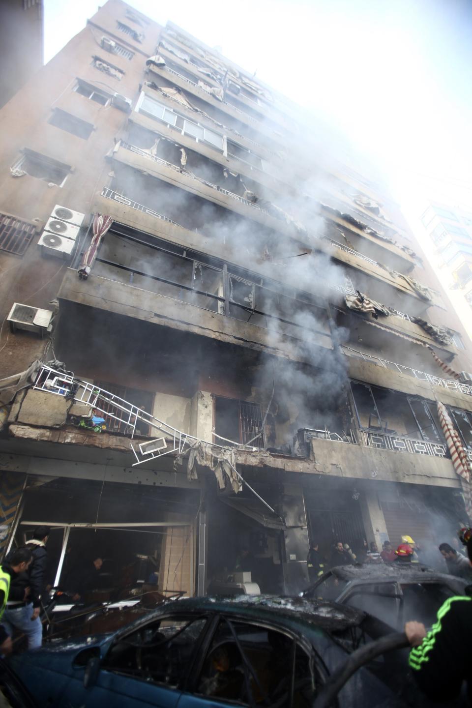 Smoke rises from a building at the site of an explosion in the Haret Hreik area, in the southern suburbs of the Lebanese capital Beirut