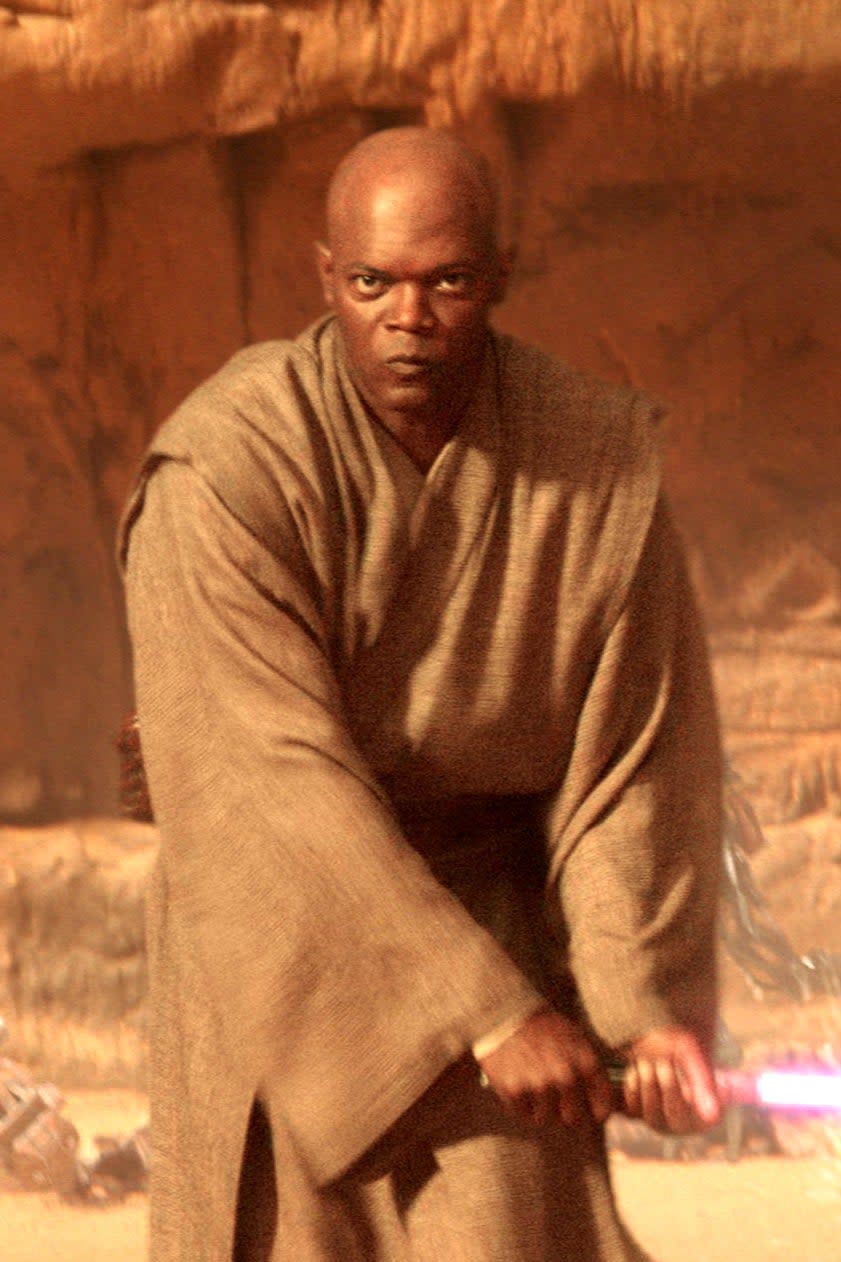 Character Mace Windu holding a lightsaber in a battle stance from Star Wars