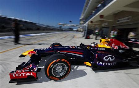 Red Bull Formula One driver Sebastian Vettel of Germany drives out of his garage during the second practice session of the Austin F1 Grand Prix at the Circuit of the Americas in Austin November 15, 2013. REUTERS/Adrees Latif