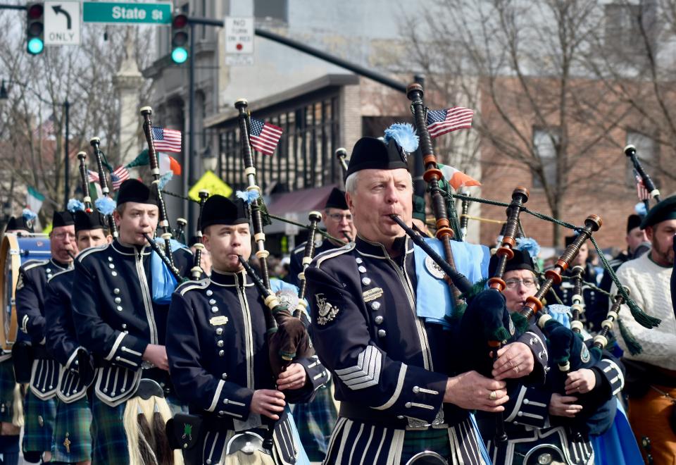 Rich Maloney, founder of the Edward P. Maloney Memorial Pipe Band, performs along Court Street at the start of Binghamton's St. Patrick's parade Saturday, March 5.