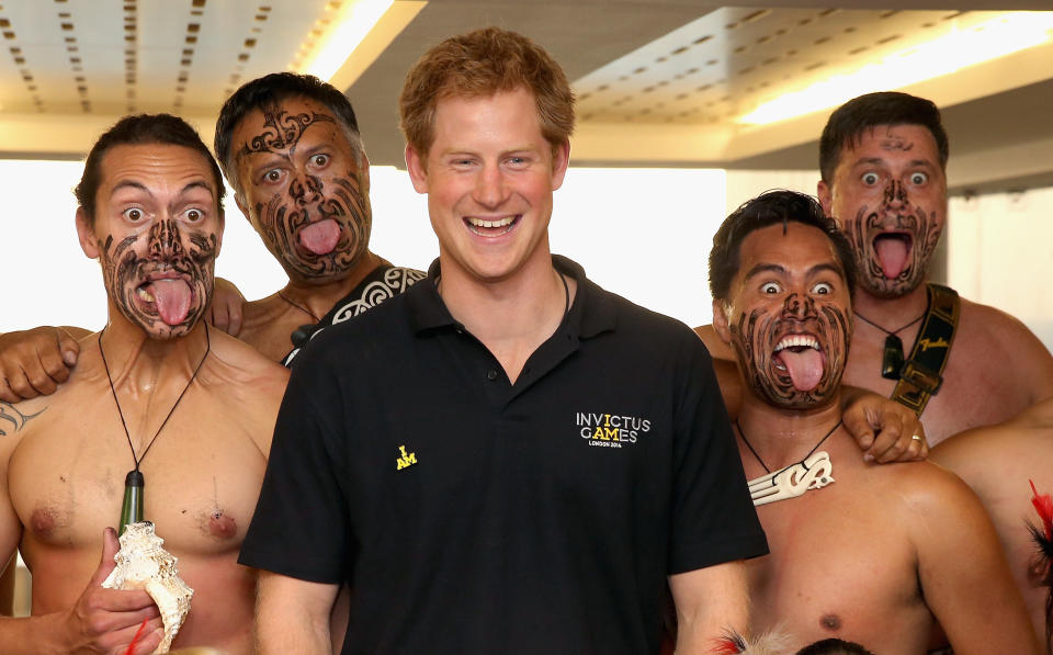 LONDON, ENGLAND - SEPTEMBER 08:  Prince Harry poses with Ngati Ranana Maori Dancers as he meets the New Zealand Invictus Team at New Zealand House on September 8, 2014 in London, England. The International sports event for 'wounded warriors', presented by Jaguar Land Rover, is just days away with limited last-minute tickets available at www.invictusgames.org  (Photo by Chris Jackson/Getty Images)