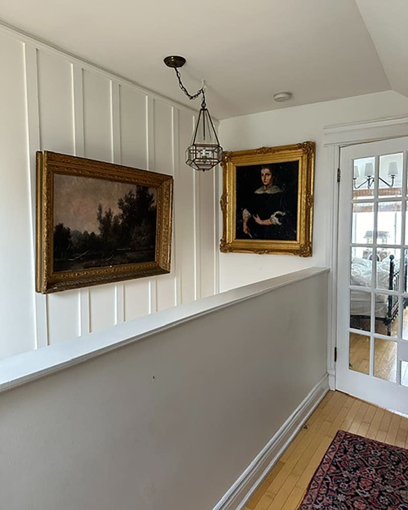 Vintage painting in renovated hallway.