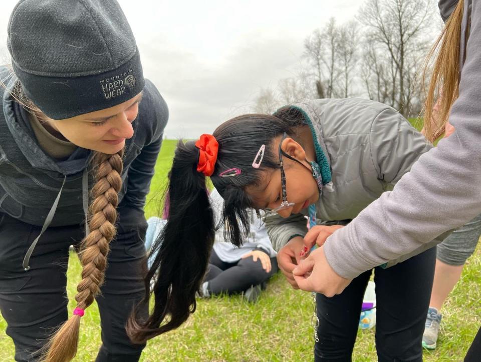 Fifth-grade students from Hills Elementary get a closeup view of nature on a field trip at Cangleska Wakan in Solon.