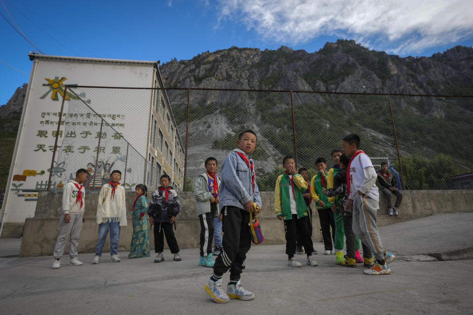 Tibetan students gather at the Shangri-La Key Boarding School during a media-organized tour in Dabpa county, Kardze Prefecture, Sichuan province, Chinaon Sept. 5, 2023. (AP Photo/Andy Wong)