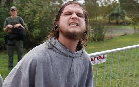 A demonstrator yells during a rally outside the location where Richard Spencer was delivering a speech in Gainesville - Credit: Reuters