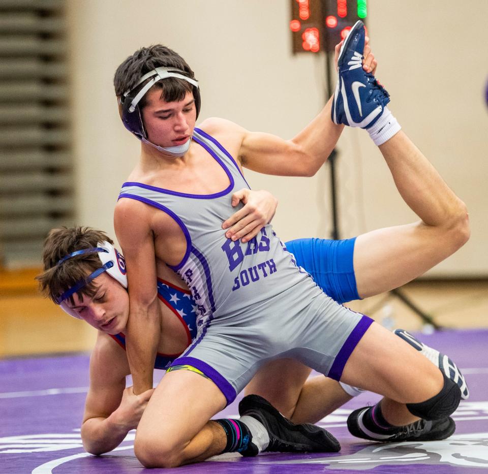 South's Carson Bohall wrestles Owen Valley's Branson Weaver in the 138 weight class during the Bloomington South versus Owen Valley wrestling match at Bloomington High School South on Wednesday, Jan. 4, 2023.