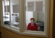 A patient breathes through an oxygen mask in a hospital for people infected with the coronavirus disease in Kyiv