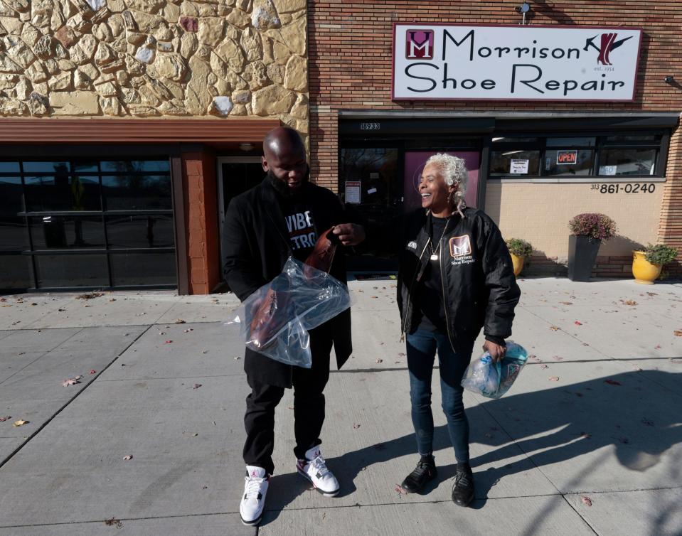 Jarelle James, 39, of Detroit, left, and Ronda Morrison of the House of Morrison Shoe Repair on Livernois in Detroit talk about the good job of refinishing and conditioning that she did on his wing tip shoes that he had just picked up at her store on the Avenue of Fashion on Saturday, Nov. 8, 2023.