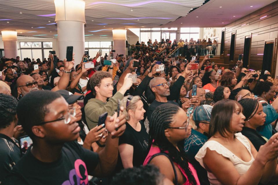 More attendees wait in the NMAAM Lobby for New Edition, April 16, 2023