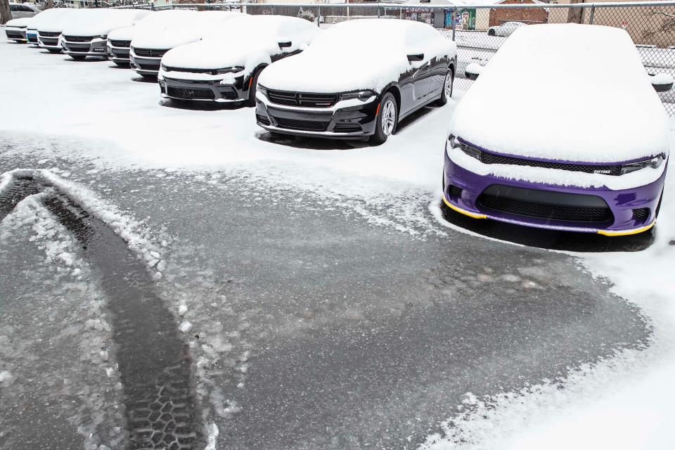 Cars sit covered in snow in a parking lot at the intersection of Dunlinden Drive and Kirkwood Highway after a snowstorm dropped close to 3 inches since yesterday in Wilmington, Tuesday, Jan. 16, 2023.