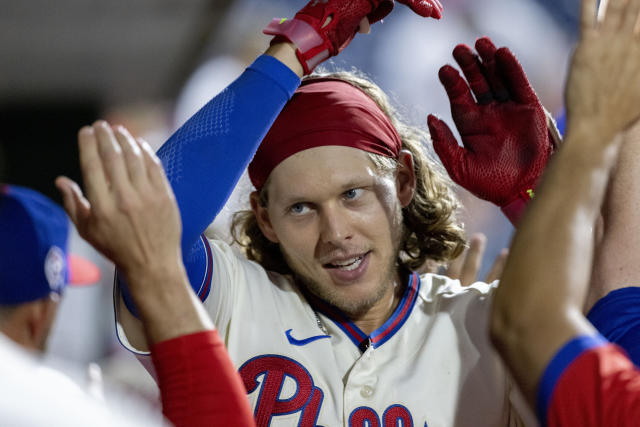 Philadelphia Phillies' Alec Bohm hits a two run home run during the seventh  inning of a baseball game against the Washington Nationals, Sunday, Sept.  11, 2022, in Philadelphia. (AP Photo/Laurence Kesterson Stock