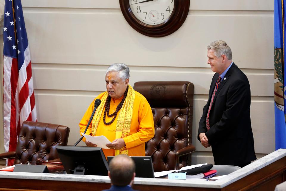 Hindu statesman Rajan Zed delivers the invocation at the start of a session of the Oklahoma Senate as Sen. Gary Stanislawski, R-Tulsa, looks on in 2018.