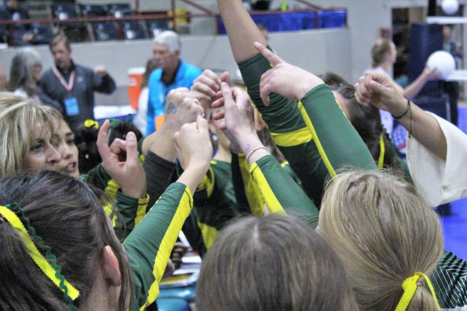 Pueblo County Hornets Volleyball team huddle up before their matchup against Discovery Canyon on day two of the Class 4A girls state volleyball tournament on Friday, Nov. 11, 2022.