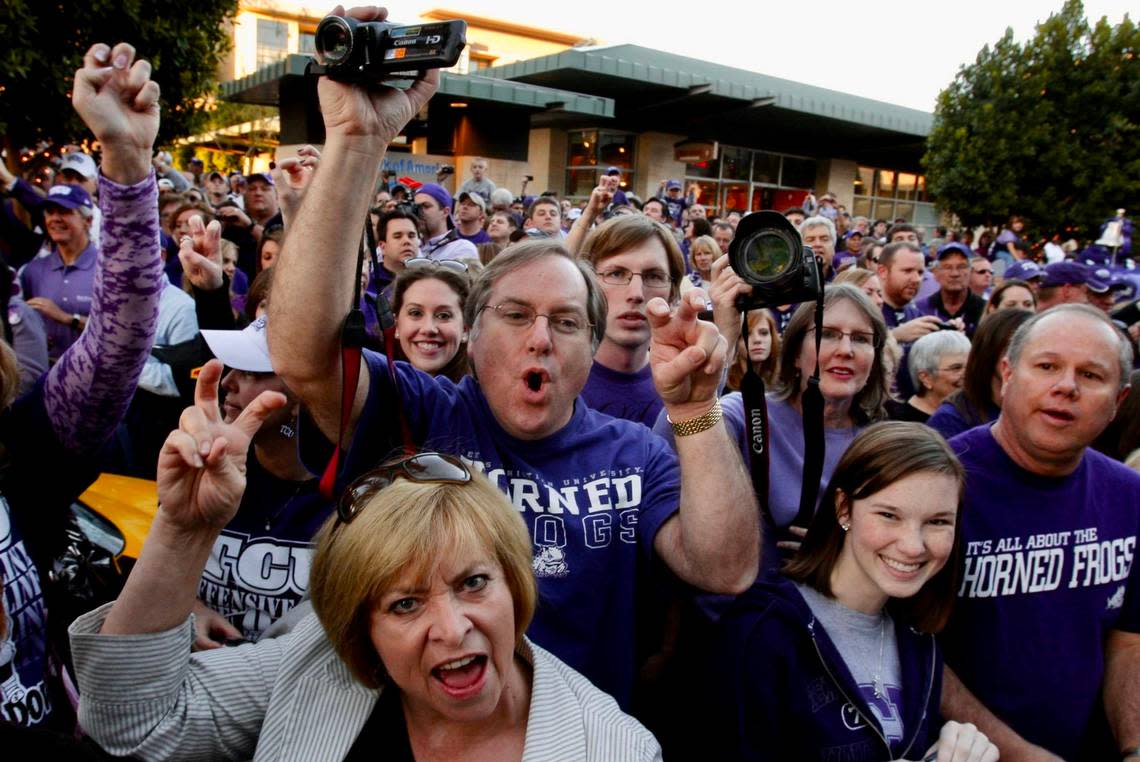 TCU fans make pictures and their signature horned frog gesture as they hold a pep rally at the Kierland Commons shopping center in Scottsdale, Arizona, Sunday January 3, 2010, in preparation for the Tostito Fiesta Bowl.