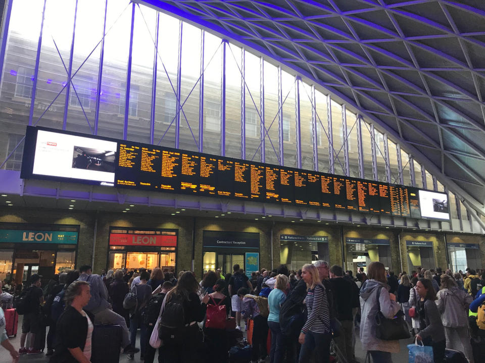 People waiting for trains at King's Cross station, London, after all services in and out of the station were suspended on Friday when a power cut caused major disruption across the country. PRESS ASSOCIATION Photo. Picture date: Saturday August 10, 2019. See PA story ENERGY PowerCut. Photo credit should read: Abbianca Makoni/PA Wire 