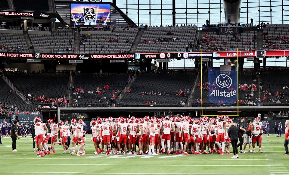 Utah Utes gather on the field as they and Northwestern prepare to play in the SRS Distribution Las Vegas Bowl on Saturday, Dec. 23, 2023. | Scott G Winterton, Deseret News