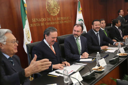 Mexico's Foreign Minister Luis Videgaray (3rd L) take part with Fernando Herrera Avila (4th L), President of the Senate's Political Coordination Board and Emilio Gamboa Patron (2nd L), Political Coordinator of the Institutional Revolutionary Party (PRI), during a meeting about foreign affairs at the Senate of the Republic building in Mexico City, Mexico, January 24, 2017. REUTERS/Edgard Garrido