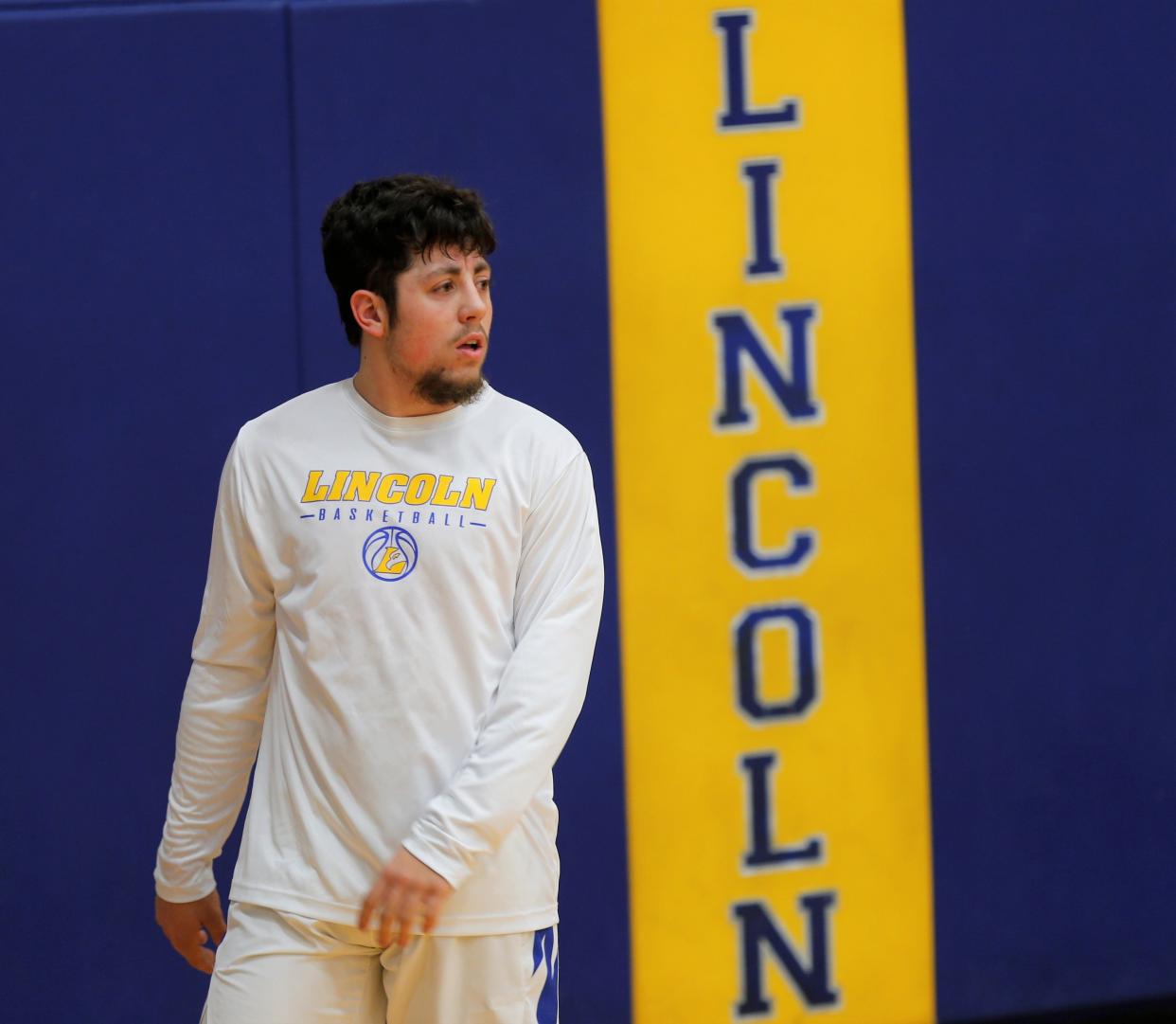 Lincoln senior Gavin Trent walks across the court before a game against Knightstown Dec. 9, 2022.