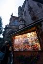 NUREMBERG, GERMANY - NOVEMBER 30: Visitors look at Christmas decorations for sale at the traditional Christmas market 'Nuernberger Christkindlesmarkt' ahead of the opening ceremony on November 30, 2012 in Nuremberg, Germany. Originated in the 16th century the Nuremberg Christmas market is seen as one of the oldest of its kind in Germany. (Photo by Johannes Simon/Getty Images)