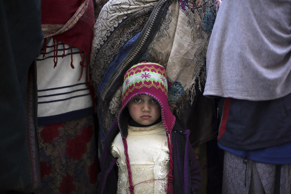 Family members of Islamic State militants either arrested or surrounded up to the Afghan government are presented to media in Kabul, Afghanistan, Saturday, Dec. 21, 2019. The country's intelligence service says Saturday that there are more than 75 women and 159 children most of them form foreign countries in the custody of the agency known as the National Deteriorate for Security. (AP Photo/Rahmat Gul)