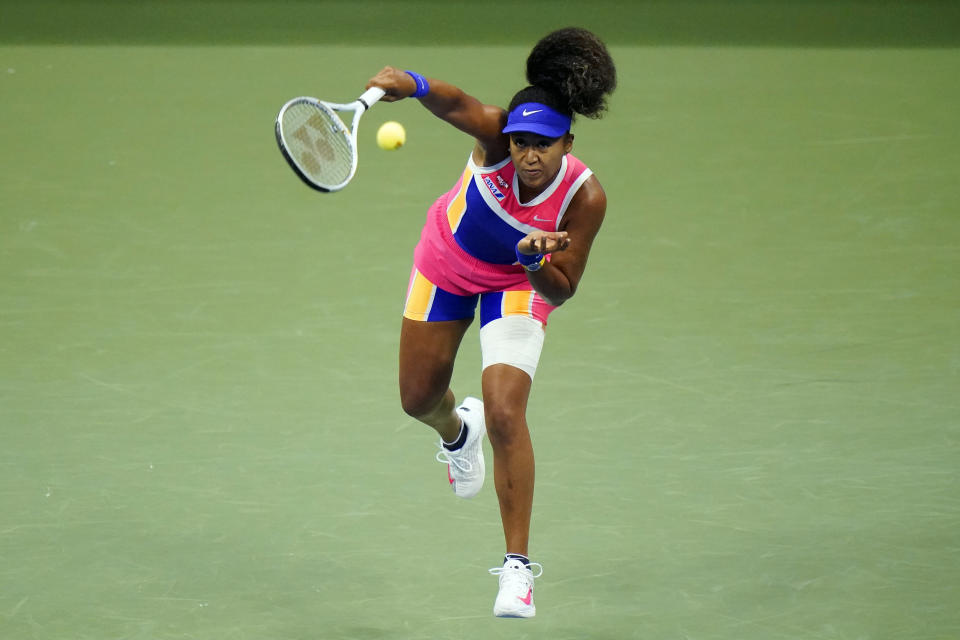 FILE - In this Sept. 6, 2020, file photo, Naomi Osaka, of Japan, serves to Anett Kontaveit, of Estonia, during the fourth round of the U.S. Open tennis tournament in New York. Osaka has been selected by The Associated Press as the Female Athlete of the Year.(AP Photo/Frank Franklin II, File)