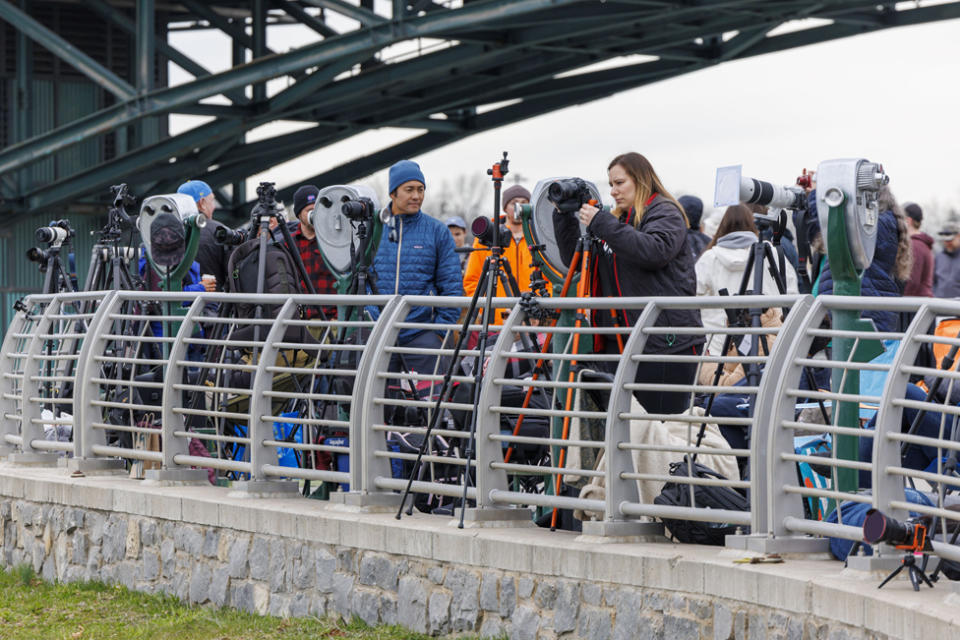 People set up cameras along the viewpoint railing hours before the total solar eclipse in Niagara Falls, New York, USA, 08 April 2024.