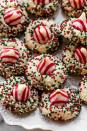 <p>Does it get any more cute and festive than these cookies? They're drop-style cookies, meaning all you have to do is scoop and bake. Roll them in your favorite sprinkles before baking and top with a Candy Cane Kiss! </p><p><strong>Get the recipe for <a href="https://sallysbakingaddiction.com/candy-cane-kiss-cookies/" rel="nofollow noopener" target="_blank" data-ylk="slk:Candy Cane Kiss Cookies;elm:context_link;itc:0;sec:content-canvas" class="link ">Candy Cane Kiss Cookies</a> at Sally's Baking Addiction.</strong></p>