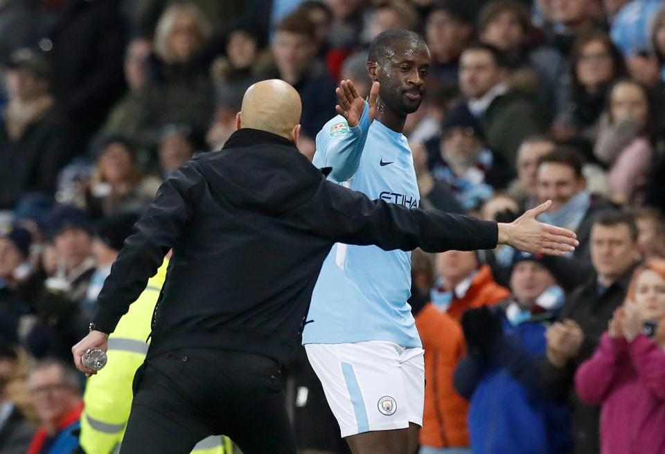 Manchester City's Yaya Toure (right) shakes hands with manager Pep Guardiola as he is substituted during the Carabao Cup Semi Final, First Leg match at the Etihad Stadium, Manchester. PRESS ASSOCIATION Photo. Picture date: Tuesday January 9, 2018. See PA story SOCCER Man City. Photo credit should read: Martin Rickett/PA Wire. RESTRICTIONS: EDITORIAL USE ONLY No use with unauthorised audio, video, data, fixture lists, club/league logos or "live" services. Online in-match use limited to 75 images, no video emulation. No use in betting, games or single club/league/player publications.