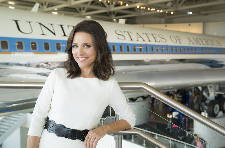 Julia Louis-Dreyfus as Selina Meyer stands in front of a plane in a museum.