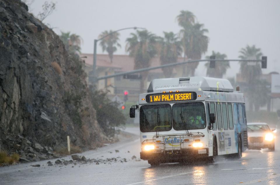 A Sunline bus avoids a small rockslide caused by heavy rains on Hwy 111 at the border of Cathedral City and Rancho Mirage, Calif., August 20, 2023.