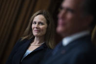 Judge Amy Coney Barrett, President Donald Trumps nominee for the U.S. Supreme Court, meets with Sen. Mitt Romney, R-Utah, on Capitol Hill in Washington, Wednesday, Sept. 30, 2020. (Tom Williams/Pool via AP)