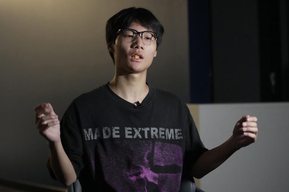 Gao Peng, son of Chinese dissident Gao Zhi, speaks during an interview with The Associated Press in Bangkok, Thailand, on July 17, 2023. Since landing in Thailand July 3, he says he has been accused of making bomb threats, put on an EU travel blacklist, and seem his mother and 16-year-old sister detained and threatened with deportation back to China. The threats, made in the family's names against airports, luxury hotels and the Chinese embassy in Bangkok derailed their plans to join Gao Zhi in the Netherlands. (AP Photo/Sakchai Lalit)