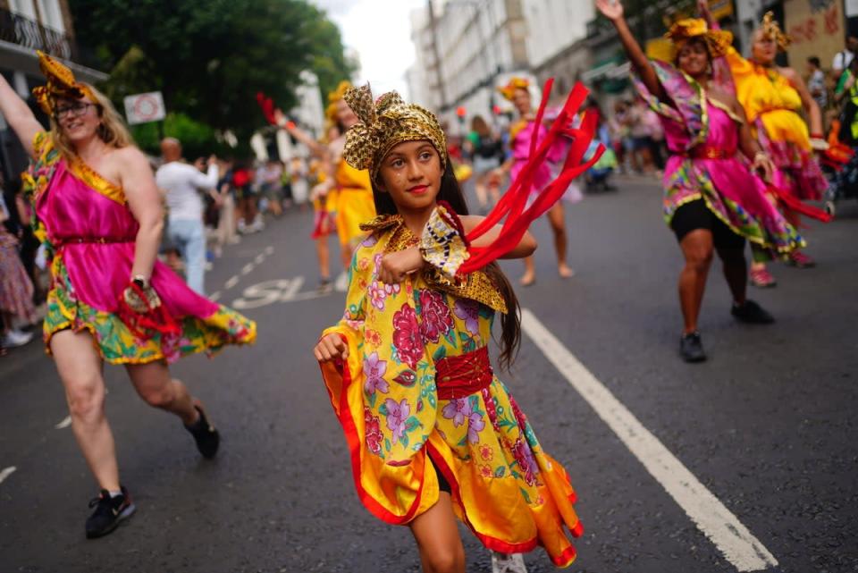 Performers during the children’s parade (Victoria Jones/PA) (PA Wire)